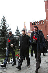 The Soyuz TMA-03M crew members conduct their ceremonial tour of Red Square on 1 December 2011. Soyuz TMA-03M crew at the Kremlin Wall.jpg