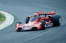 After taking on Alfa Romeo engines, the Brabhams were painted rosso corsa red. Stommelen auf Brabham 1976.jpg