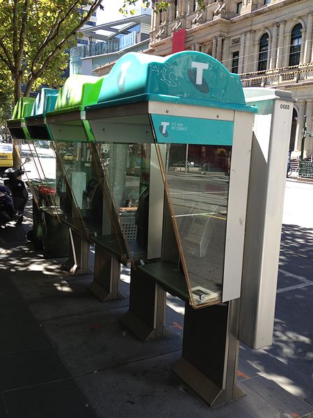 Telstra phone booths showing the current colour scheme, replacing the former orange logo with shades of green and blue.