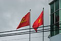 The national flag beside the flag of the Communist Party of Vietnam