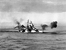 Mississippi supporting Lingayen Gulf landing. USS West Virginia and HMAS Shropshire are in the background. USS Mississippi (BB-41), USS West Virginia (BB-48) and HMAS Shropshire (73) bombarding Luzon on 8 January 1945.jpg