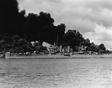 Phoenix passing the battleships West Virginia and Arizona at Pearl Harbor in 1941. USS Phoenix (CL-46) steams down the channel at Pearl Harbor on 7 December 1941 (NH 50766).jpg