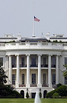 US Navy 040609-F-3050V-009 The U.S. flag atop the White House flies at half-staff in honor of former President Ronald Reagan who passed away on June 5, 2004.jpg