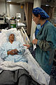 US Navy 080831-N-7540C-441 Lt. Reynalda Mcbee talks to a pre-op patient moments before her cataract surgery.jpg