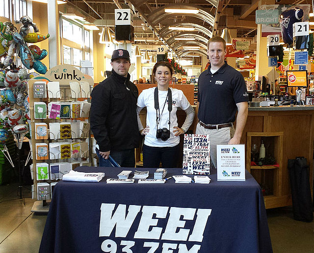 WEEI promotional booth at a supermarket in Boston.