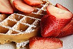 Waffle with strawberries and confectioner's sugar.jpg