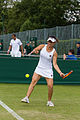 Xu Yifan competing in the second round of the 2015 Wimbledon Qualifying Tournament at the Bank of England Sports Grounds in Roehampton, England. The winners of three rounds of competition qualify for the main draw of Wimbledon the following week.