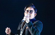 Lee performing in 2018