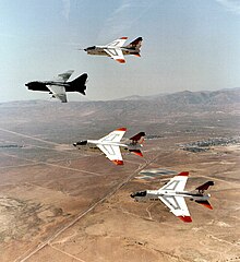 Prototype YA-7Ds 67-14582 and 67-14584, along with 69-6191 and 69-6217 making last flyover retirement formation over Edwards AFB, California, heading to AMARC, August 1992