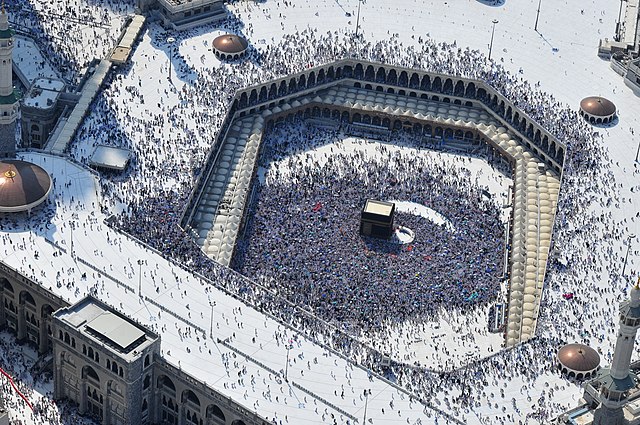 Aerial view of the Sacred Mosque (Al-Masjid Al-Ḥarām) of Mecca in Saudi Arabia, the largest mosque and holiest site in Islam, with the Kaaba in the ce