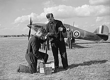 Armourers preparing belts of .303-inch ammunition for Hawker Hurricane Mk I DU-J