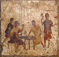 Fresco depicting ancient Roman dice players Bar-Lupanar Osteria della Via di Mercurio Pompeii VI 10, 1-19 Detail of fresco from east end of south wall of rear room - Painting of men gambling courtesy of Nicolas Monteix 2003.jpg