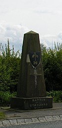 A monument at the site of the Battle of the Standard, where the troops Thurstan had mustered defeated the Scots. Battle of the Standard.jpg