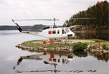 A Bell 205A-1 on firefighting duty with the Ontario Ministry of Natural Resources at Nym Lake, Ontario, Canada, 1996 Bell205AC-FJTG.JPG