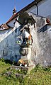 Baroque statue of John of Nepomuk at the wall of the Church of Saint George in the village of Blansko, Český Krumlov District