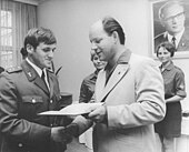 FDJ Second Secretary Herger awarding customs agents with the FDJ's Artur-Becker-Medal in August 1972 Bundesarchiv Bild 183-L0822-0034, Berlin, Auszeichnungen an Zollbeamte.jpg