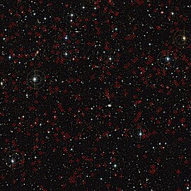 COSMOS field imaged by the Canada France Hawaii Telescope (CFHT). Red crosses mark some of the active galaxies with supermassive black holes at their centers.