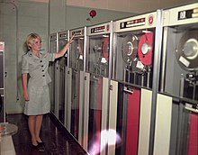 PFC Patricia Barbeau operates a tape-drive on the IBM 729 at Camp Smith.