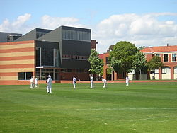 The Cripps Centre (left) and main buildings (right) at Caulfield Campus, with Alf Mills Oval in the foreground Caulfield.JPG