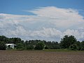 Clouds over tilled field - panoramio.jpg
