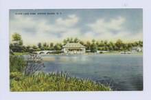 Lake and restaurant, early 20th century postcard Clove Lake Park, Staten Island, N.Y. (view of restaurant and foot bridge from water) (NYPL b15279351-104822).tiff