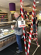 Corona Netherlands taped lines & cordoning off coffee shop.jpg