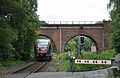 Deutsch: Ein Triebwagen der Euregiobahn passiert die Dreibogenbrücke. Das Bild entstand auf einem Feldweg außerhalb des Gefahrenbereichs. English: A Talent DMU of Euregiobahn passes Dreibogenbrücke in Eschweiler.