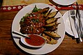 * Nomination Nigerian food at Argungu restaurant: Roasted plantain and peppered chicken breast --Kritzolina 20:36, 17 November 2019 (UTC) * Decline  Oppose - Looks tasty, but unsharp and underexposed. -- Ikan Kekek 01:33, 18 November 2019 (UTC)
