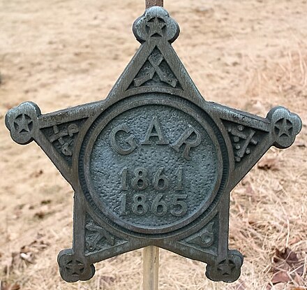 GAR marker, beside a veteran's grave in Portland Street Cemetery, South Berwick, Maine