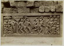 Bas-relief of weapons, shields, and fighting stances at Borobudur (9th century) KITLV 27979 - Kassian Cephas - Relief of the hidden base of Borobudur - 1890-1891.tif