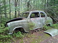 English: Decaying automobile wreck in the abandoned junk yard at Kyrkö mosse, south of Tingsryd, Sweden. Svenska: Sönderrostande bilvrak på den övergivna bilskroten på Kyrkö mosse söder om Tingsryd.