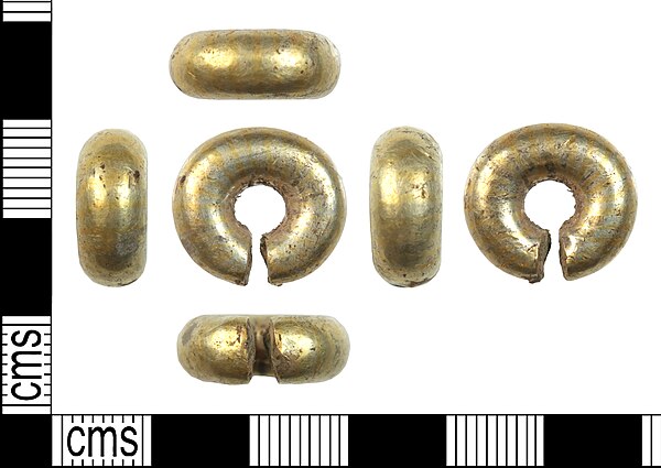 A late-Bronze Age, gold penannular ring, dating from c. 1150 – c. 800 BCE, found in Downton in 2019