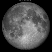 Lunar libration with phase Oct 2007 frame.png