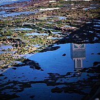 Minaret's reflection on the Atlantic water