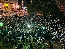 Newcastle United fans celebrating the completed takeover of the team outside St James' Park on 7 October 2021 Newcastle United fans gather celebrating new ownership.jpg