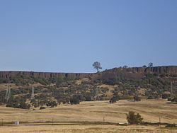 Southwest cliff faces of South Table Mountain, near Highway 70 North table mountain lava rocks.jpg