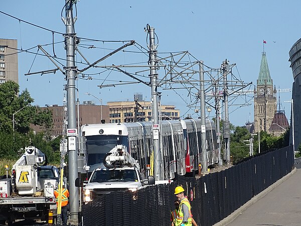 Repairs being done to the catenary system following a July 2022 lightning strike