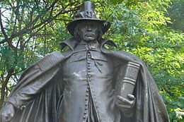 The Puritan by Augustus St. Gaudens, 1904. The "buckle hat" atop the sculpture's head, now associated with the Pilgrims in pop culture, was fictional; Pilgrims never wore such an item, nor has any such hat ever existed as a serious piece of apparel. Pilgrim Fairmount 2.jpg