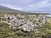 Rectangular stone wall near the coast