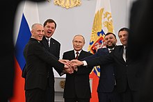Saldo (left) and three other Russian-installed oblast leaders shaking hands with Vladimir Putin to celebrate the annexations President Vladimir Putin celebrating with Russian-installed leaders of the four regions 3.jpg
