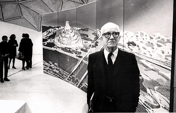 Buckminster Fuller with a drawing of his domed city proposal
