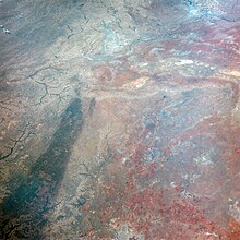 This image of Texas, obtained by astronauts aboard NASA's Gemini 4 spacecraft, shows a large dark swath attributed to rainfall. Rain-Darkened Texas.jpg