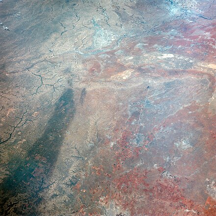 This image of Texas, obtained by astronauts aboard NASA's Gemini 4 spacecraft shows a large dark swath attributed to rainfall.