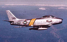 An F-86, a single-seat jet aircraft, in flight