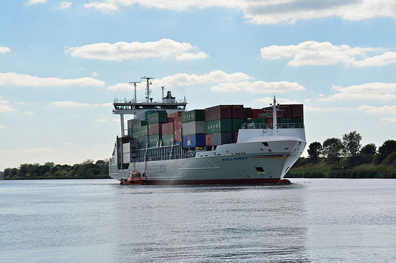 A pilot entert a moving container ship at the pilot station Rüsterbergen on the Kiel Canal.