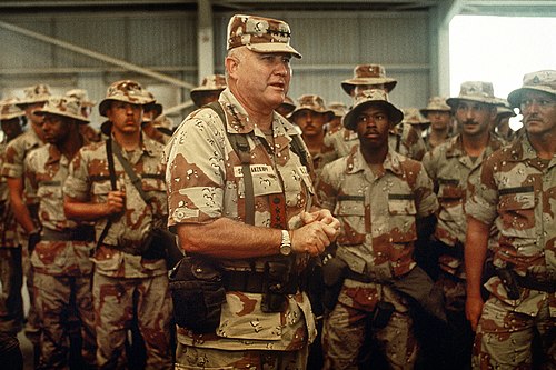General Norman Schwarzkopf Jr. speaks with American troops during the Gulf War.