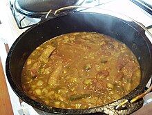 Smothered pork roast and gravy in black pot HRoe 2012.jpg