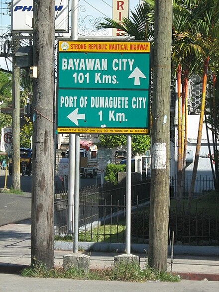 SRNH signage in Dumaguete, showing directions and distances to major cities and ports
