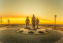 Memorial statues made in honour of the three RCMP officers killed in the shooting in Moncton Sunrise Behind the RCMP Memorial in Moncton (33322758294).jpg