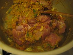 Step 6 - Biryani Masala: adding and mixing chicken pieces